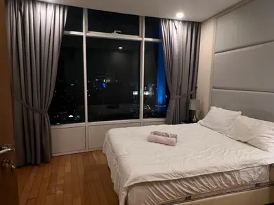 a bed in a room with a large window at Vortex KLCC (42) Amazing view in Kuala Lumpur