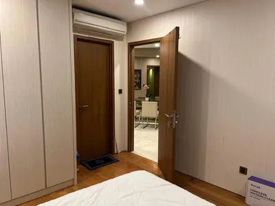 a bedroom with a door open to a room with a bed at Vortex KLCC (42) Amazing view in Kuala Lumpur