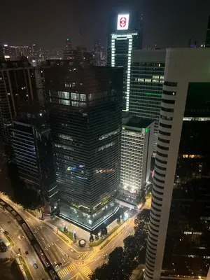 a large building in a city at night with traffic at Vortex KLCC (42) Amazing view in Kuala Lumpur