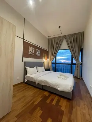 a bedroom with a large bed and a large window at Reizz Residence By Sweet Home in Kuala Lumpur