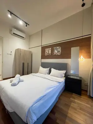 a large white bed in a room with at Reizz Residence By Sweet Home in Kuala Lumpur
