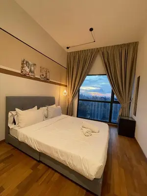 a bedroom with a large bed with a large window at Reizz Residence By Sweet Home in Kuala Lumpur
