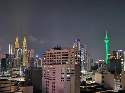 a view of a city skyline at night at Chambers A Studio Flat, KLCC & KL Tower view, City in Kuala Lumpur