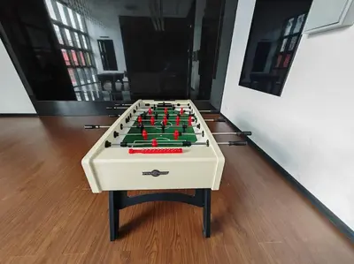a foosball table sitting on top of a floor at Chambers A Studio Flat, KLCC & KL Tower view, City in Kuala Lumpur