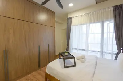 a bedroom with a large bed and a window at Arte Mont Kiara by MY TRIP & MY STAY in Kuala Lumpur