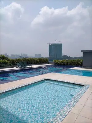 a large swimming pool on top of a building at KL2-4pax studio nr KTM&Midvalley in Kuala Lumpur