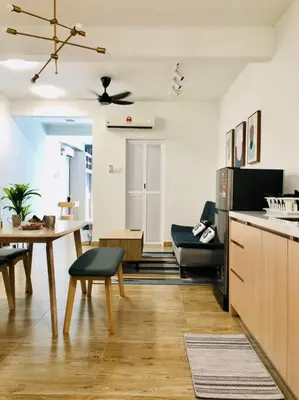 a kitchen and living room with a table and a dining room at KL2-4pax studio nr KTM&Midvalley in Kuala Lumpur