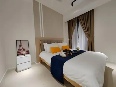 a bedroom with a large bed and a television at Arcoris Mont Kiara 2# Sunway 163# 2-Bedroom with balcony 2-4Pax in Kuala Lumpur