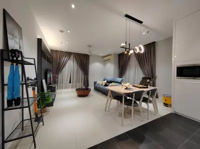 a living room with a table and a couch at Arcoris Mont Kiara 19#Main Street# Walking Distance 1MK# 1BR 1-3Pax in Kuala Lumpur