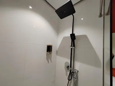a bathroom with a shower with a speaker on the wall at Arcoris Mont Kiara 19#Main Street# Walking Distance 1MK# 1BR 1-3Pax in Kuala Lumpur