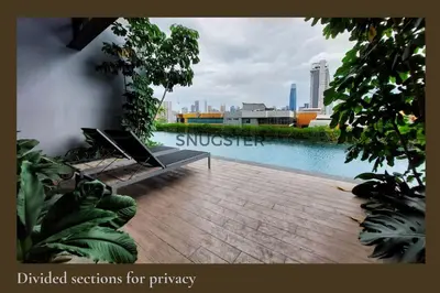 a view of a swimming pool in a city at Stunning Pool & the City Studio- 1 Mrt stop to TRX in Kuala Lumpur