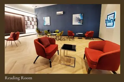a waiting room with chairs and tables in a hospital at Stunning Pool & the City Studio- 1 Mrt stop to TRX in Kuala Lumpur