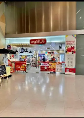 a mall with a grocery store with a sign that reads muncties at Summer Suites KLCC By Victorians in Kuala Lumpur