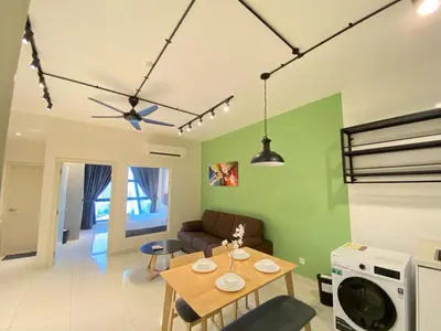 a living room with a table and a couch at VALENTINA SUITES @ ARTE MONT KIARA in Kuala Lumpur