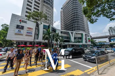 a group of people walking on a city street at Mont Kiara Cozy 2 #2Bedroom with Balcony #Arcoris in Kuala Lumpur