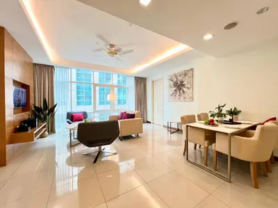 a living room with a table and a dining room at Lot163 By ZenGlo in Kuala Lumpur