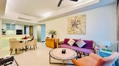 a living room with a couch and a table at Lot163 By ZenGlo in Kuala Lumpur