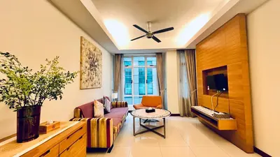 a living room with a couch and a table at Lot163 By ZenGlo in Kuala Lumpur