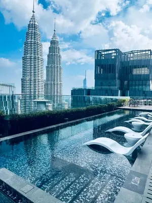 a pool of water with buildings in the background at Star at KLCC By EAE in Kuala Lumpur