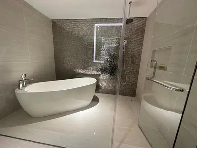 a bathroom with a tub and a glass shower at Star at KLCC By EAE in Kuala Lumpur