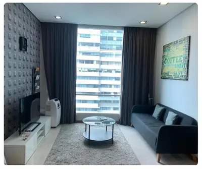 a living room with a couch and a coffee table at Soho Suites KLCC in Kuala Lumpur
