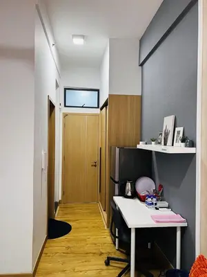 a room with a desk and a hallway with a door at Voyage Bedroom, The Luxe Colony in Kuala Lumpur