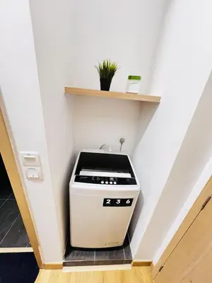 a kitchen with a stove in the middle of a room at Voyage Bedroom, The Luxe Colony in Kuala Lumpur