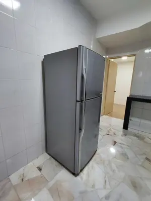 a stainless steel refrigerator sitting in a kitchen at Nice Stay 16pax at Wisma Cosway Pavilion KLCC Bukit Bintang in Kuala Lumpur