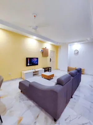 a living room with a large couch and a flat screen tv at Nice Stay 16pax at Wisma Cosway Pavilion KLCC Bukit Bintang in Kuala Lumpur