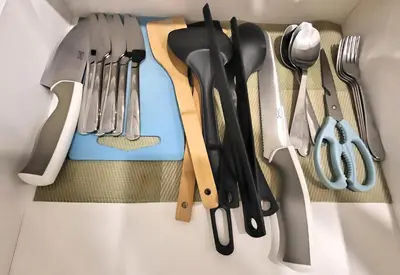 a bunch of utensils sitting on top of a table at Robertson Residences in Kuala Lumpur