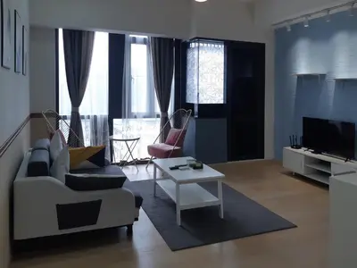 a living room with a couch and a table at KLCC Star Suites by BBA in Kuala Lumpur
