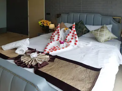 a bed with christmas pillows on top of it at KLCC Star Suites by BBA in Kuala Lumpur