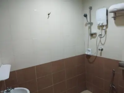 a bathroom with a shower and a sink at KL CITY LODGE in Kuala Lumpur