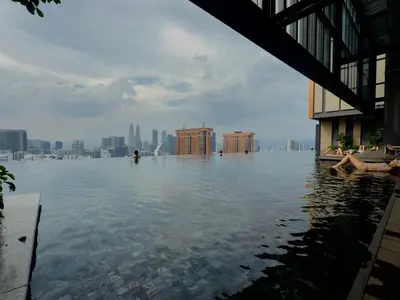 a pool of water with a city in the background at Smart Home at Lucentia Residence BBCC Lalaport in Kuala Lumpur