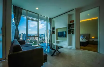 a living room with a couch and a large window at The Platinum KLCC By Luxe Suites in Kuala Lumpur