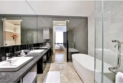 a bathroom with four sinks and a tub and a shower at The Platinum KLCC By Luxe Suites in Kuala Lumpur