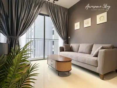 a living room with a couch and a table at Sunway Velocity Two By Awesomestay in Kuala Lumpur