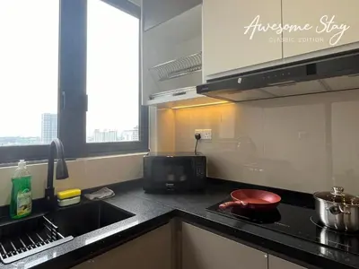 a kitchen with a sink and a counter top at Sunway Velocity Two By Awesomestay in Kuala Lumpur