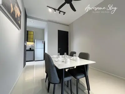 a dining room with a white table and chairs at Sunway Velocity Two By Awesomestay in Kuala Lumpur