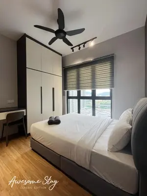 a bedroom with a bed with a ceiling fan at Sunway Velocity Two By Awesomestay in Kuala Lumpur