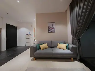 a living room with a gray couch in a room at Arcoris Mont Kiara 7# Main Street #Walking 1MK# 163 Retails# 2 BR Balcony 2-4Pax in Kuala Lumpur