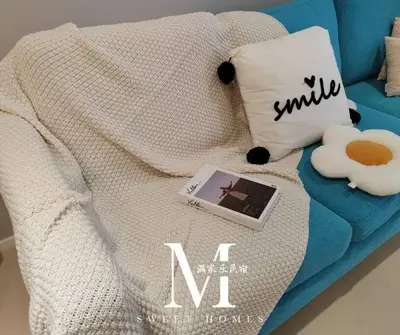 a blanket on a couch with a laptop on it at Arcoris Mont Kiara 19# Deluxe 1 Bedroom With Balcony KL #1-3Pax in Kuala Lumpur