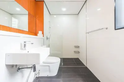 a bathroom with a toilet and a sink and a shower at Arcoris Mont Kiara 12# Deluxe 2 Bedroom # Coner with Balcony #1-4Pax in Kuala Lumpur