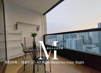 a dining room with a table and a large screen at Arcoris Mont Kiara 23# 2 Bedroom Balcony #2-4pax in Kuala Lumpur