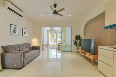 a living room with a couch and a tv at Maxhome Premium at Quill Residence KL City Centre in Kuala Lumpur