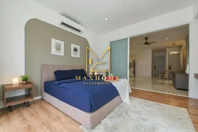 a bedroom with a king size bed and a living room at Maxhome Premium at Quill Residence KL City Centre in Kuala Lumpur