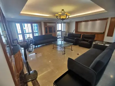 a large living room with couches and a screen at Fahrenheit88 2minsPavilionKL TRX by Abby Stay in Kuala Lumpur