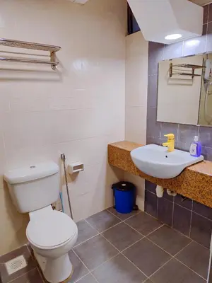 a bathroom with a toilet and a sink at Fahrenheit88 2minsPavilionKL TRX by Abby Stay in Kuala Lumpur