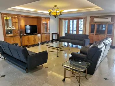 a living room with couches and a tv at Fahrenheit88 2minsPavilionKL TRX by Abby Stay in Kuala Lumpur