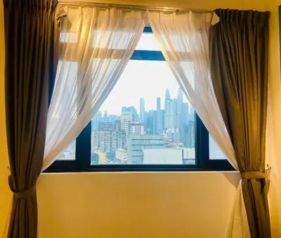 a window with a view of a city at Chambers Residences ZFJ World in Kuala Lumpur